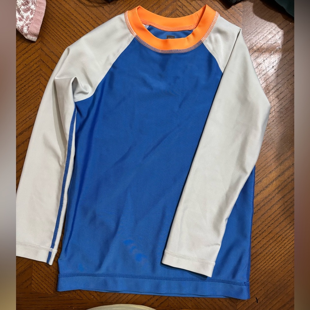 TEA Collection Blue and White Long Sleeve rash guard with Orange Accents